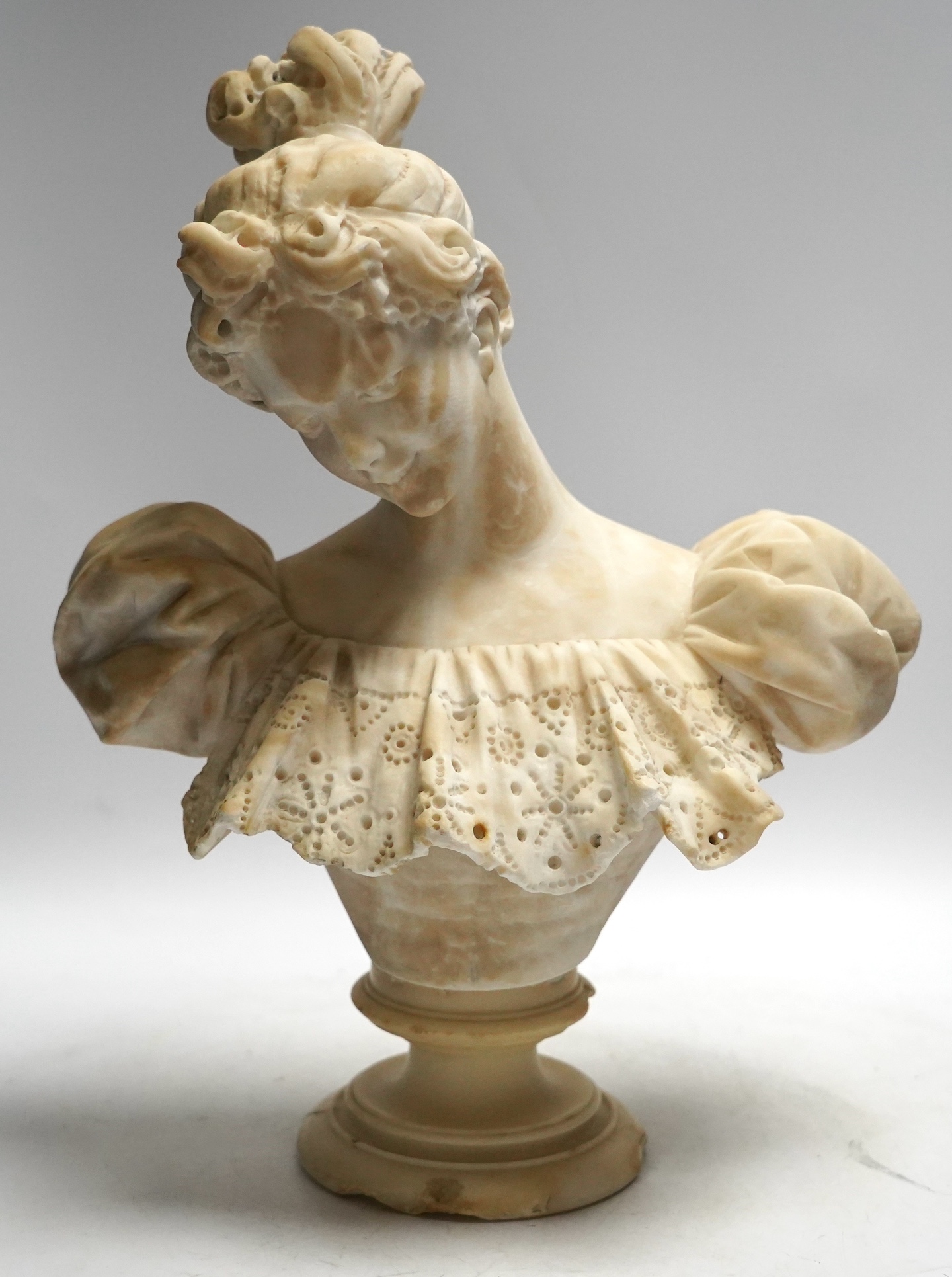 A late 19th century carved alabaster bust of a young woman, 40cm high. Condition - damaged